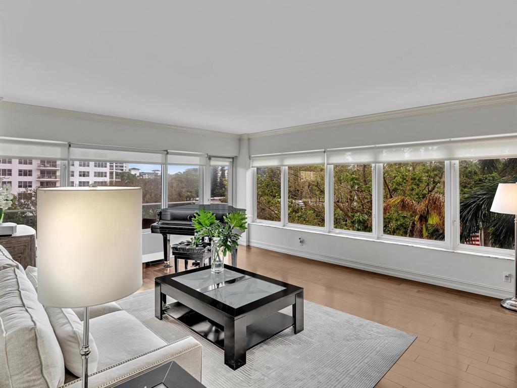 701 East Camino Real, Unit 4E Boca Raton, FL 33432 - Photo 11 of 45 a living room with furniture and a potted plant