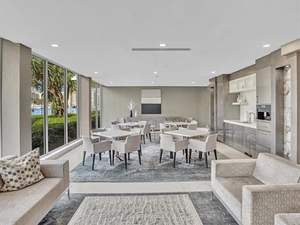 701 East Camino Real, Unit 4E Boca Raton, FL 33432 - Photo 3 of 45 a living room with lots of furniture and a large window
