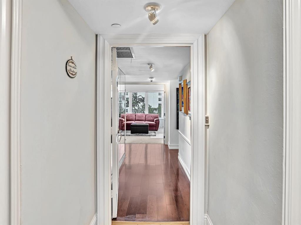 701 East Camino Real, Unit 4E Boca Raton, FL 33432 - Photo 31 of 45 a view of a hallway view with furniture and wooden floor