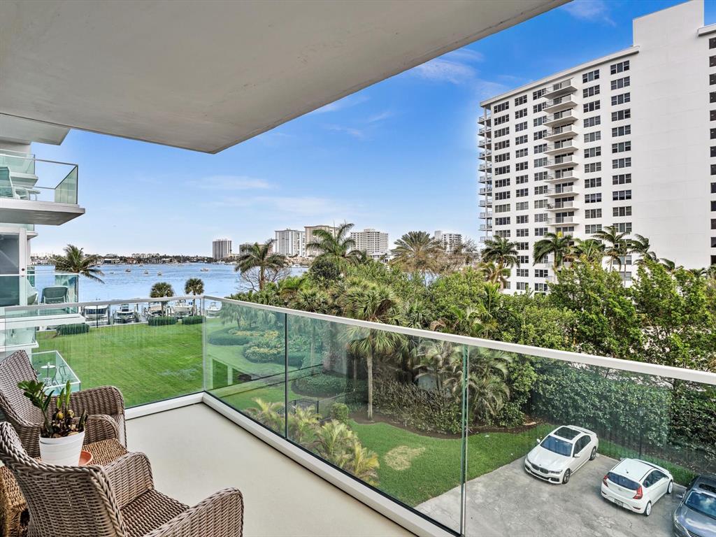701 East Camino Real, Unit 4E Boca Raton, FL 33432 - Photo 34 of 45 a view of a patio with couches chairs and a table