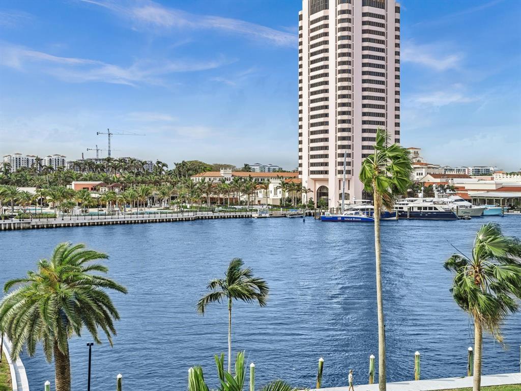 701 East Camino Real, Unit 4E Boca Raton, FL 33432 - Photo 39 of 45 a view of balcony with potted plants and palm trees