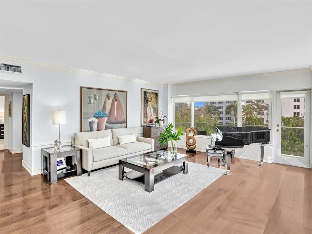 701 East Camino Real, Unit 4E Boca Raton, FL 33432 - Photo 9 of 45 a living room with furniture and a large window
