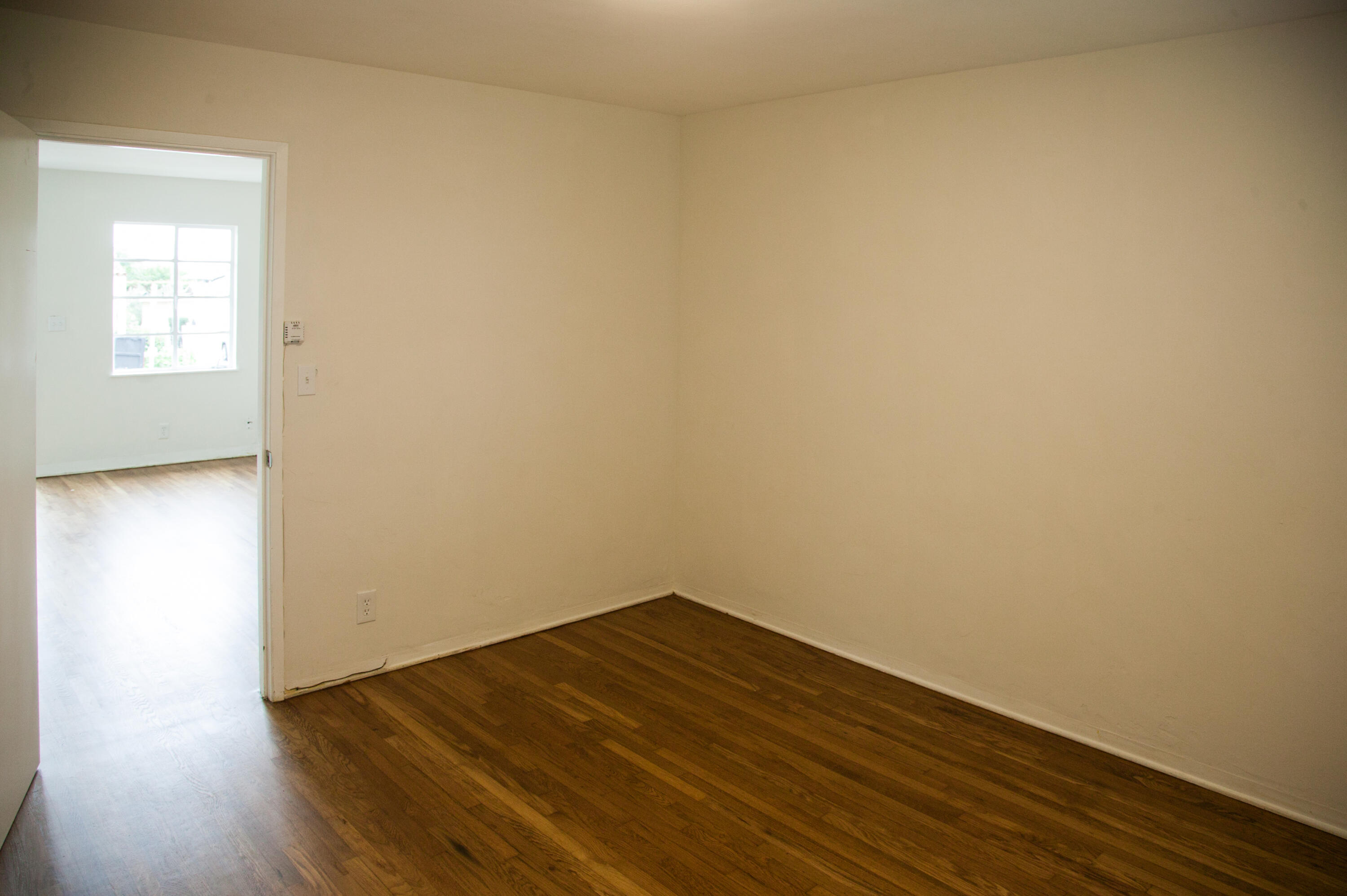 815 East Figueroa Street Santa Barbara, CA 93103 - Photo 13 of 17 a view of a small space with wooden floor and a window