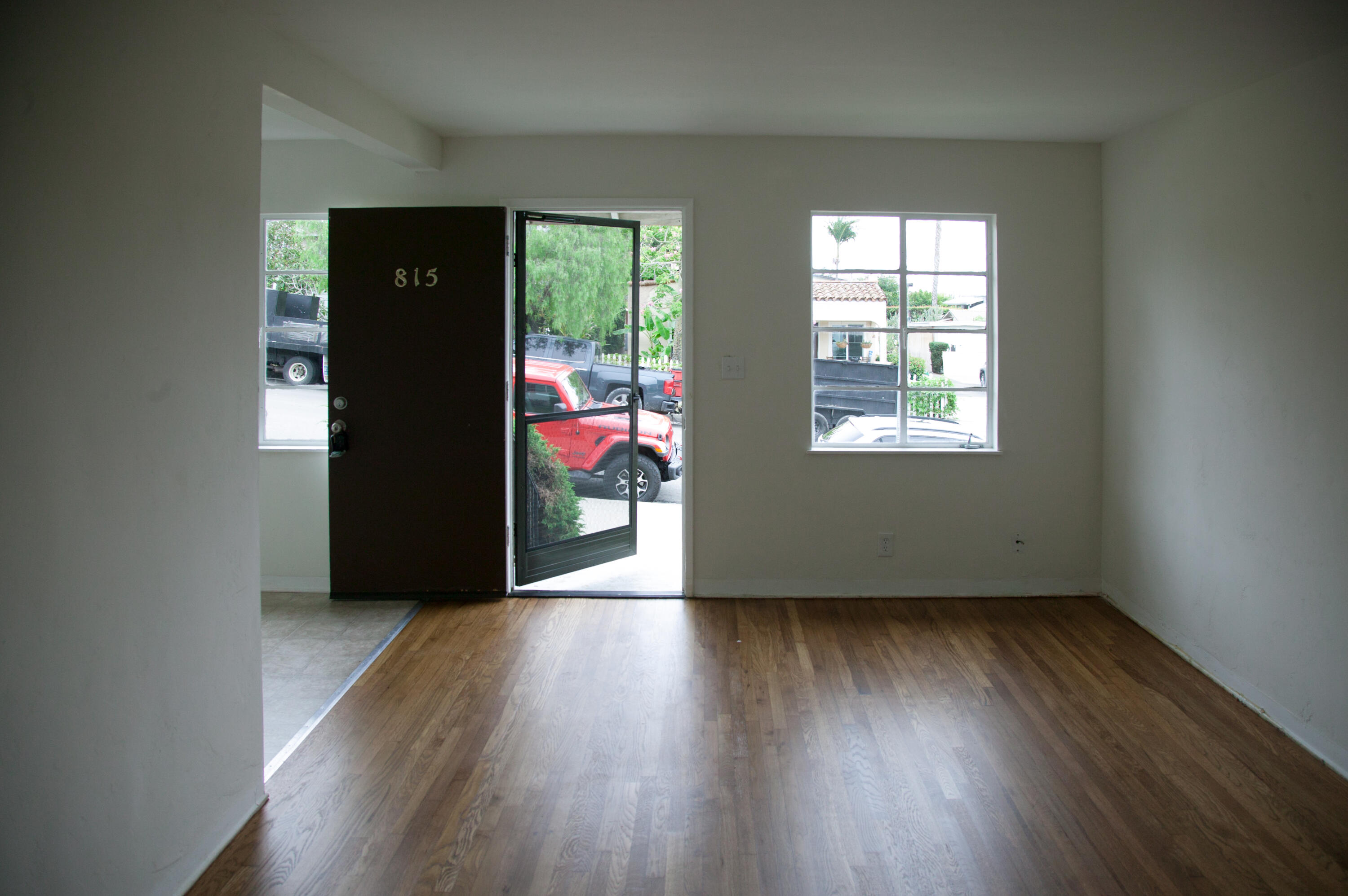815 East Figueroa Street Santa Barbara, CA 93103 - Photo 2 of 17 an empty room with wooden floor and windows