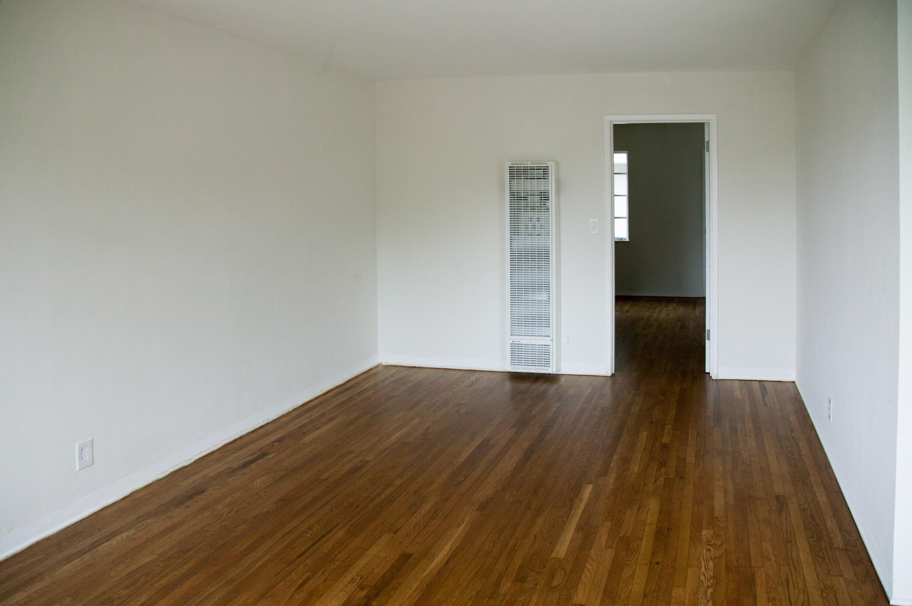 815 East Figueroa Street Santa Barbara, CA 93103 - Photo 7 of 17 wooden floor in a hall with an empty room