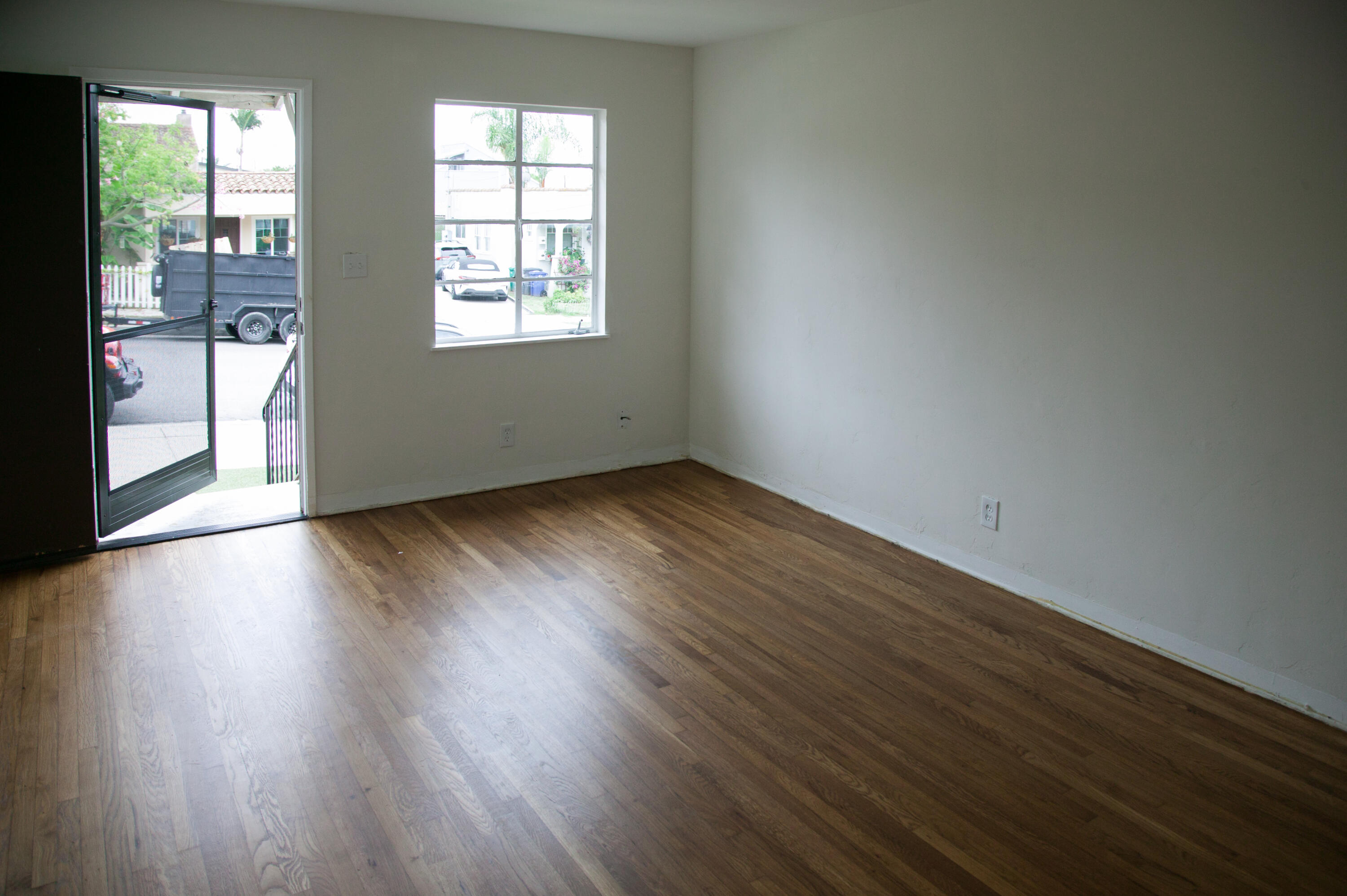 815 East Figueroa Street Santa Barbara, CA 93103 - Photo 8 of 17 an empty room with wooden floor and windows
