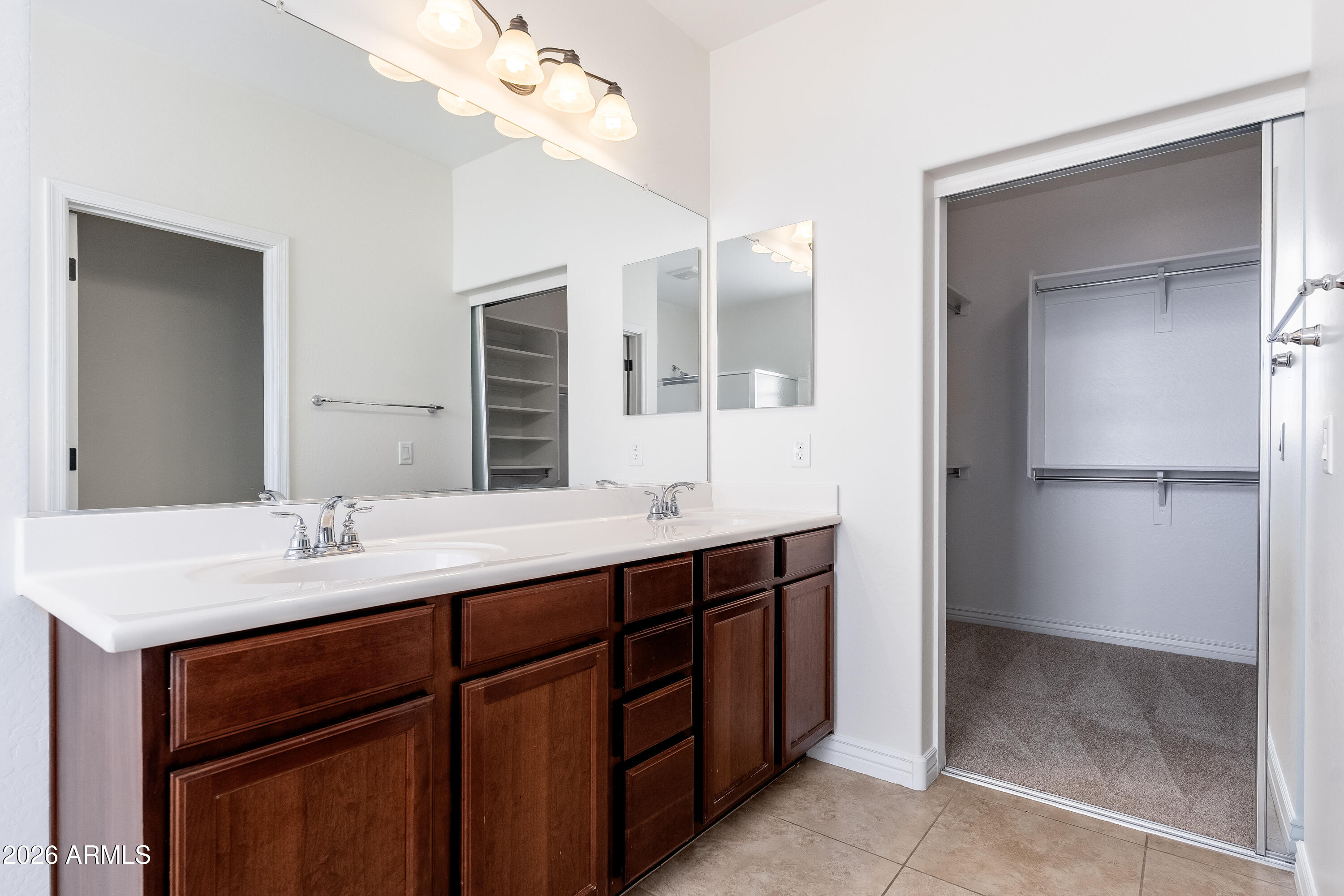 4317 East Folgers Road Phoenix, AZ 85050 - Photo 15 of 40 a bathroom with a sink a vanity and a mirror