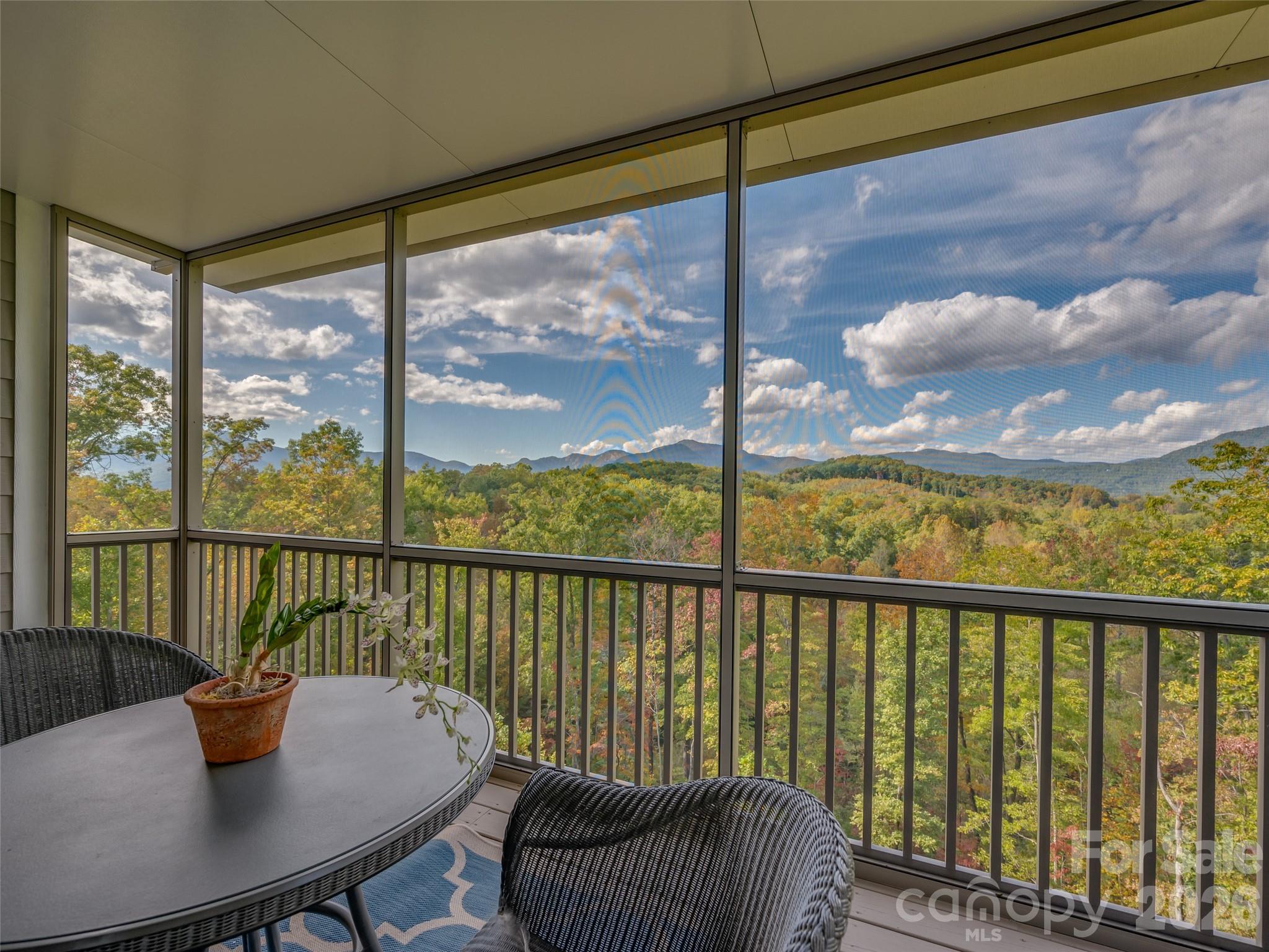 146 Red Hawk Knoll Lake Lure, NC 28746 - Photo 21 of 34 a view of a city from a balcony with furniture