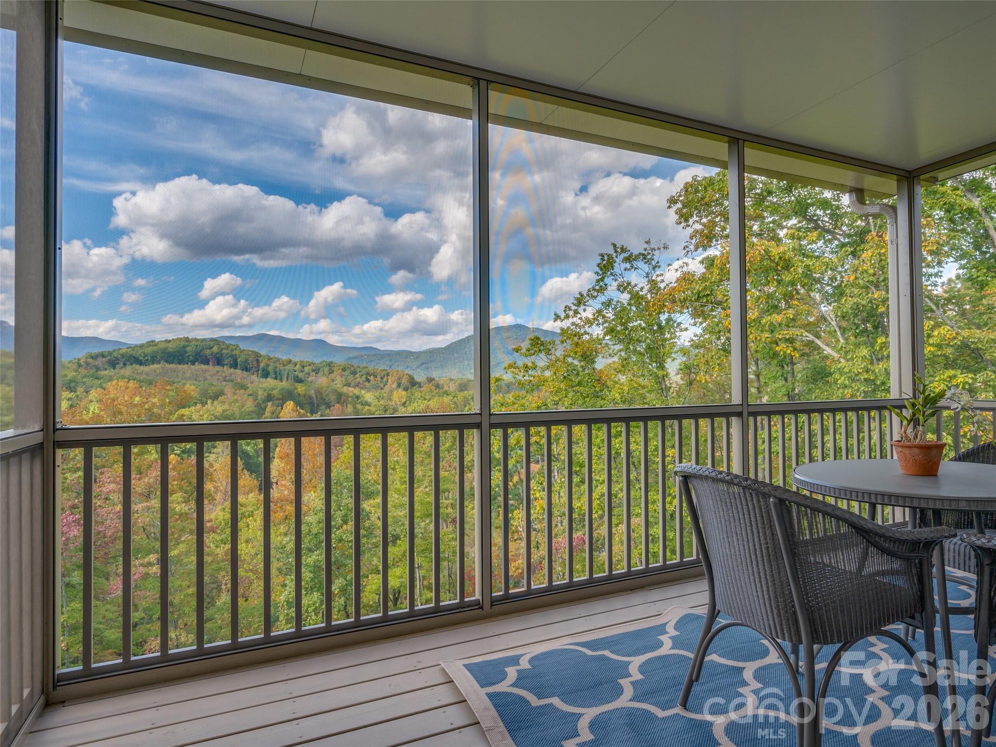 146 Red Hawk Knoll Lake Lure, NC 28746 - Photo 22 of 34 a view of a chair and table in the balcony