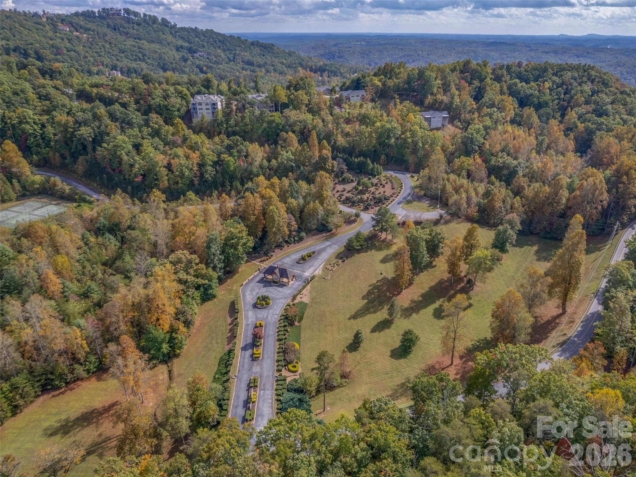 146 Red Hawk Knoll Lake Lure, NC 28746 - Photo 28 of 34 an aerial view of a house with a yard