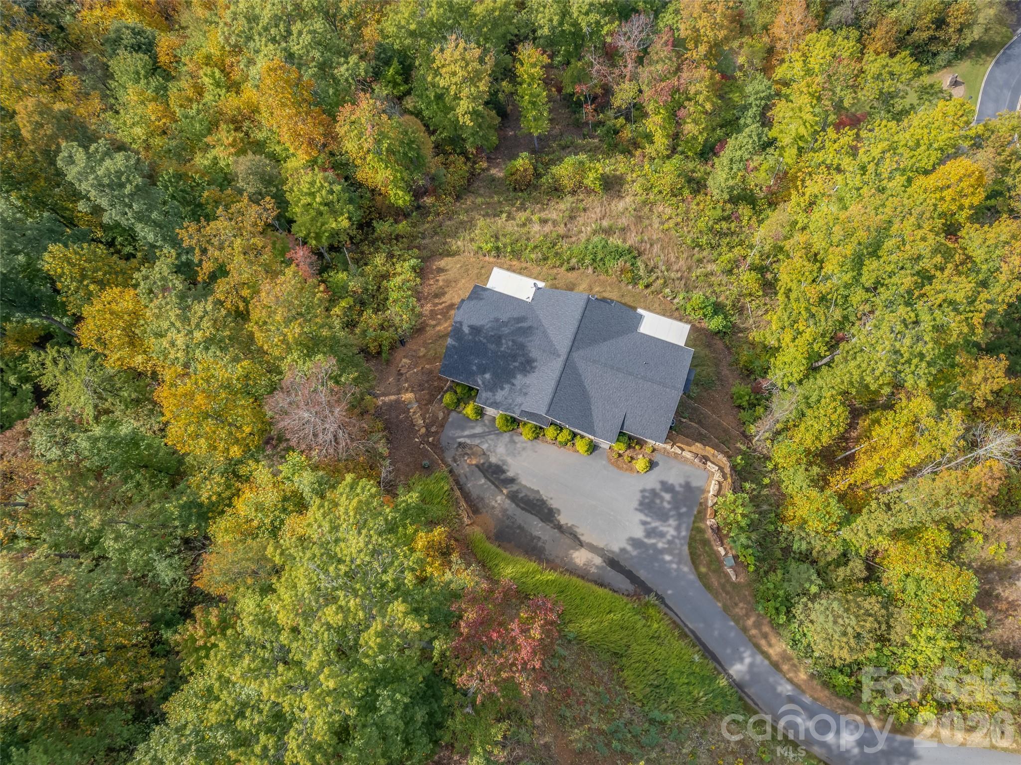 146 Red Hawk Knoll Lake Lure, NC 28746 - Photo 3 of 34 an aerial view of a house with yard swimming pool and outdoor seating