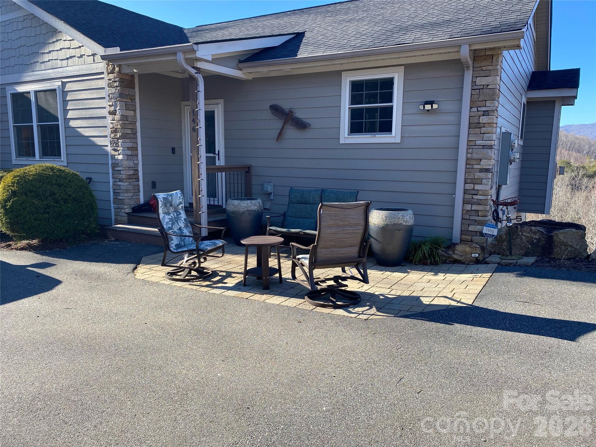 146 Red Hawk Knoll Lake Lure, NC 28746 - Photo 34 of 34 a view of a patio with a chairs and table in a patio