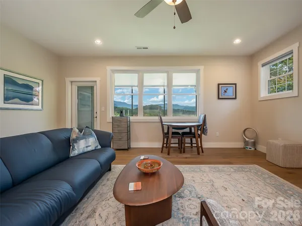 a living room with furniture and a table