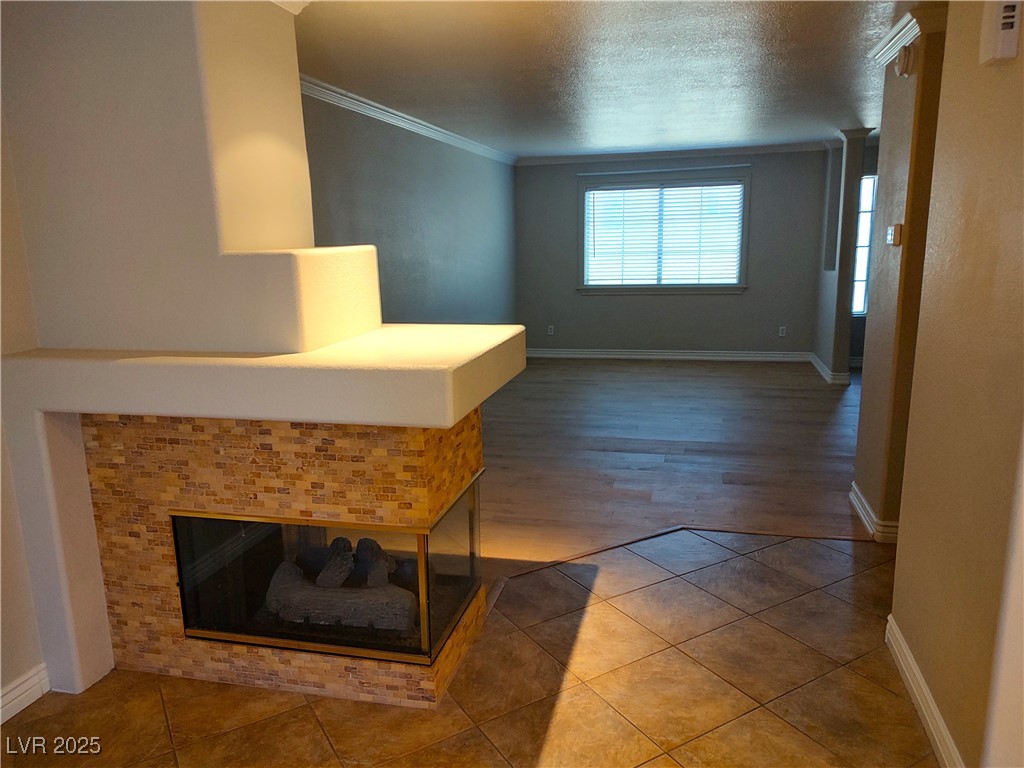 2223 Rugged Mesa Drive Laughlin, NV 89029 - Photo 11 of 28 Hallway featuring a textured ceiling, baseboards,