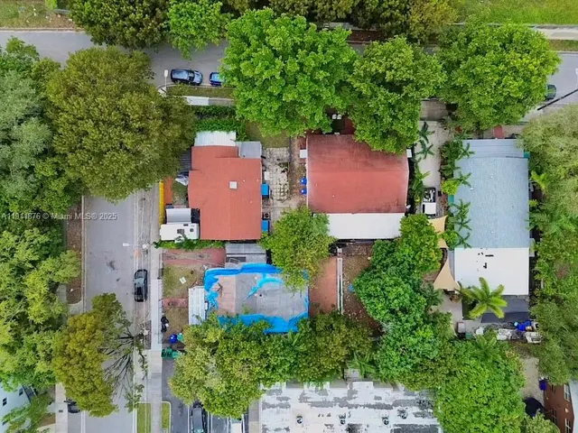 an aerial view of a house with an outdoor space