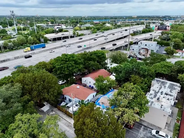 an aerial view of a house with a garden