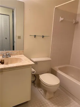 a bathroom with a toilet and shower