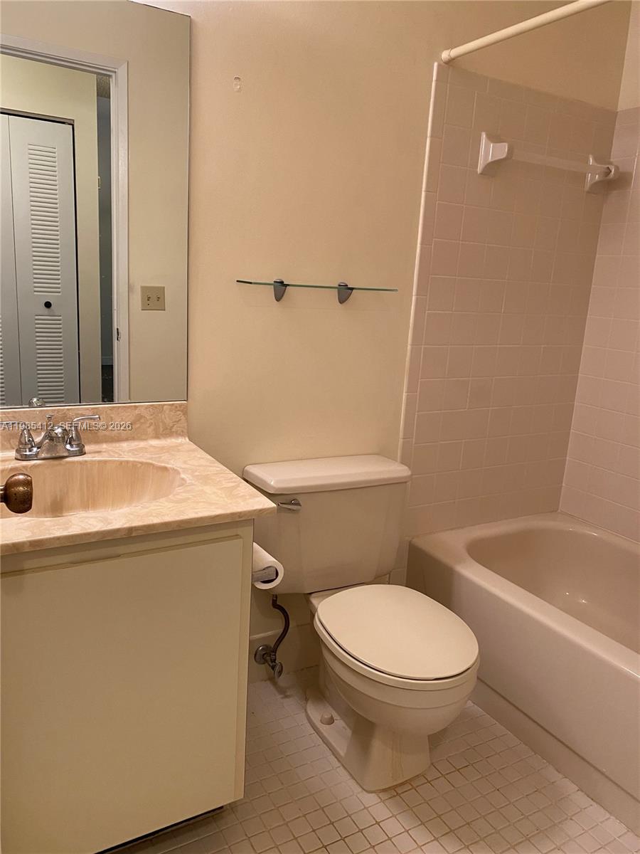 18595 Egret Way, Unit 18595 Boca Raton, FL 33496 - Photo 11 of 66 a bathroom with a sink a toilet and shower