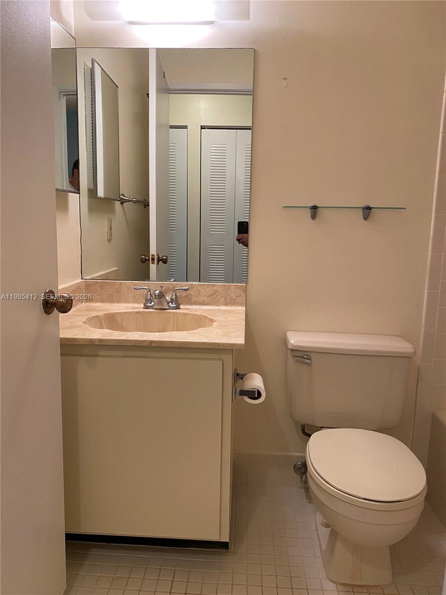 18595 Egret Way, Unit 18595 Boca Raton, FL 33496 - Photo 12 of 66 a bathroom with a sink a toilet and shower