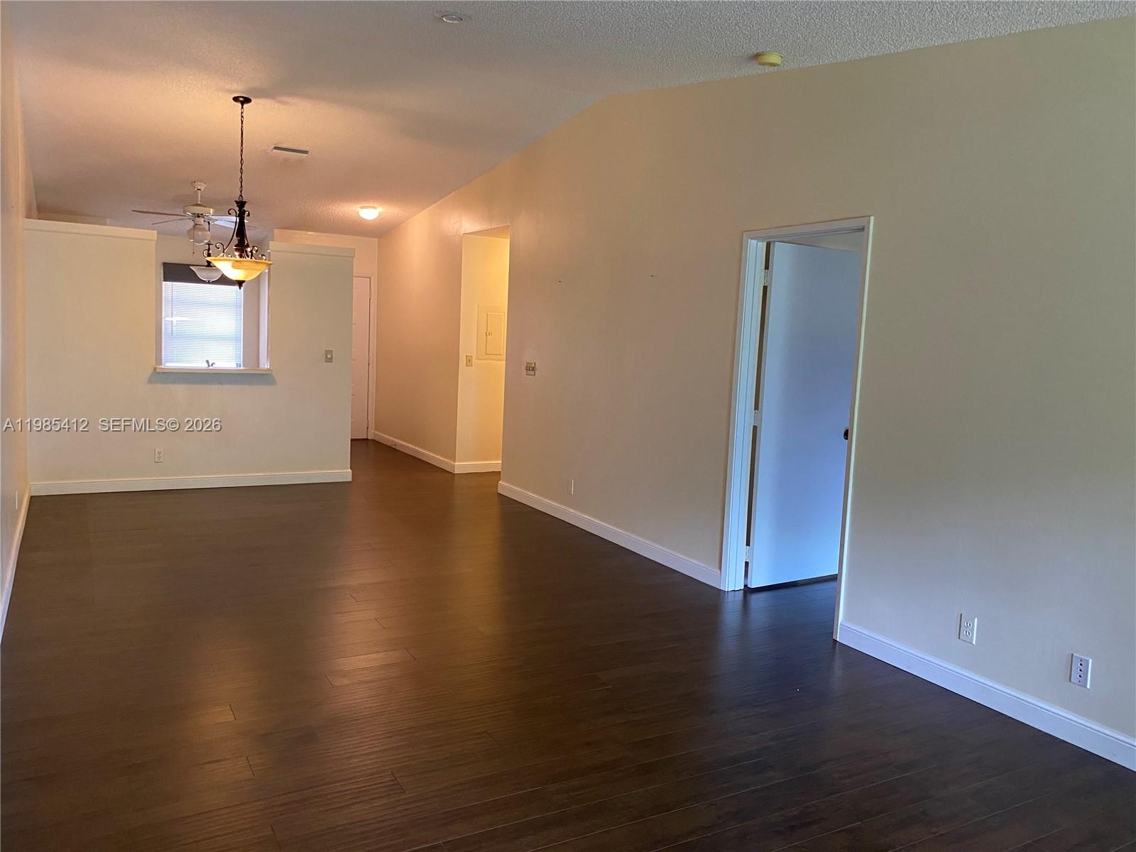 18595 Egret Way, Unit 18595 Boca Raton, FL 33496 - Photo 13 of 66 a view of a room with wooden floor