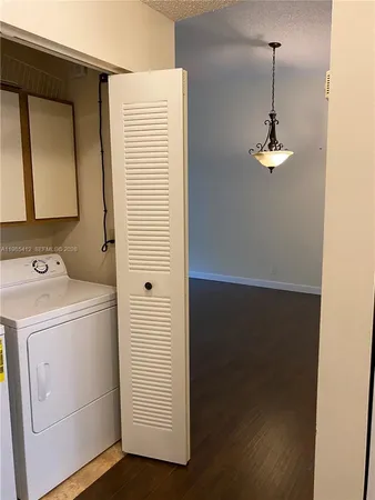 an empty room with wooden floor