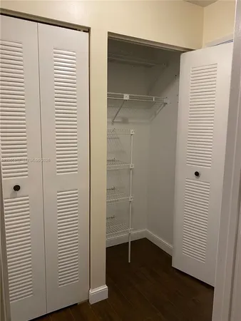 a view of a hallway with a white walls