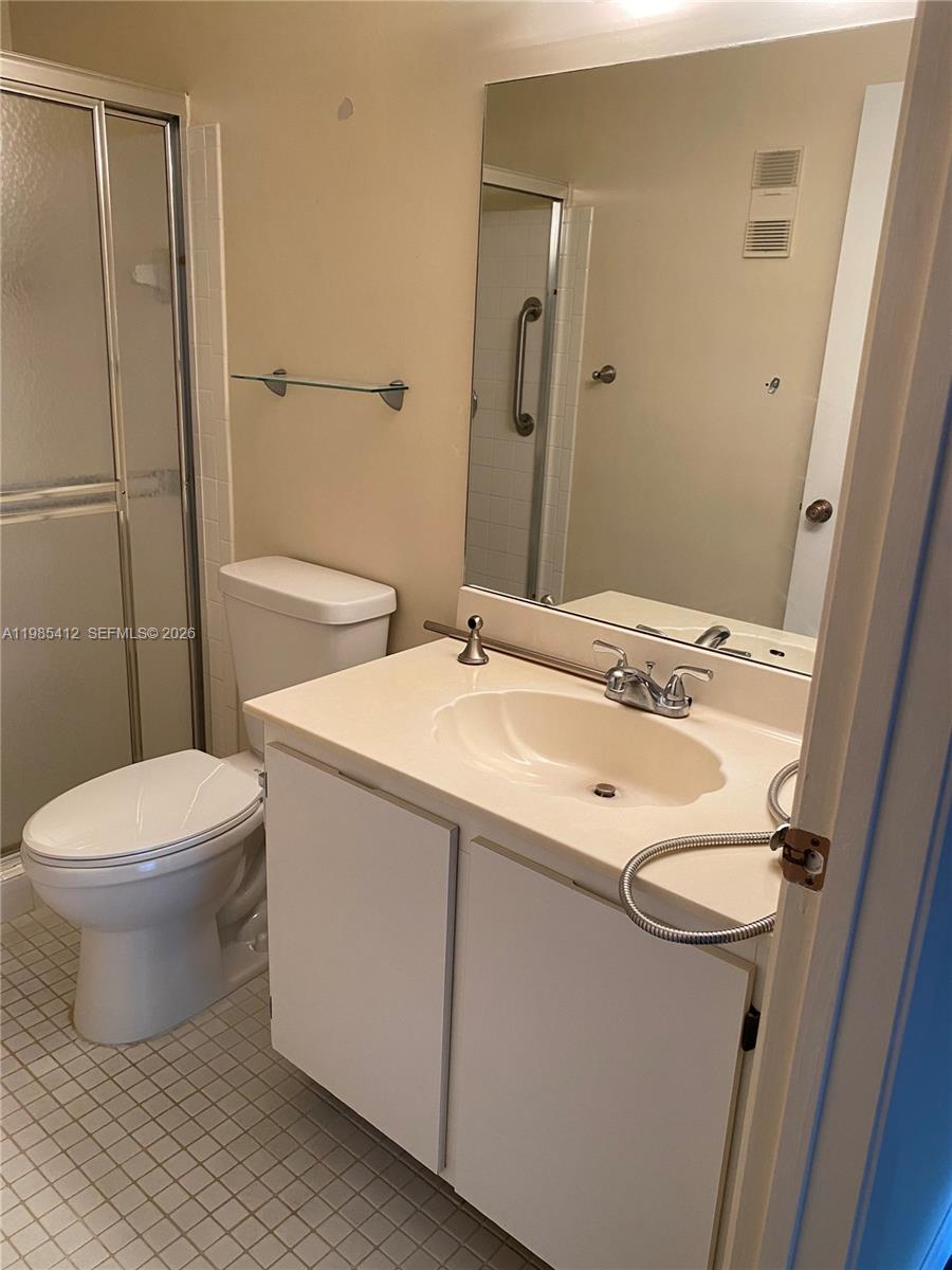 18595 Egret Way, Unit 18595 Boca Raton, FL 33496 - Photo 32 of 66 a bathroom with a sink toilet and shower