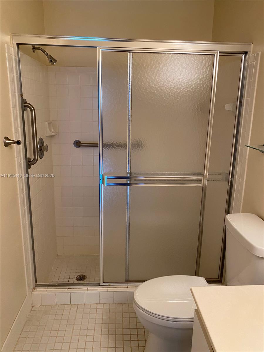 18595 Egret Way, Unit 18595 Boca Raton, FL 33496 - Photo 33 of 66 a bathroom with a toilet and a shower