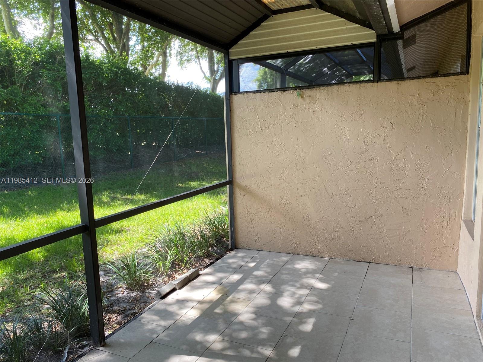 18595 Egret Way, Unit 18595 Boca Raton, FL 33496 - Photo 38 of 66 a view of a glass door