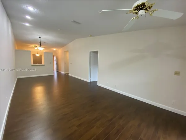 a kitchen with stainless steel appliances a stove a microwave and a refrigerator