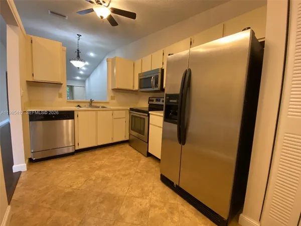 a view of a floor to ceiling window next to a yard