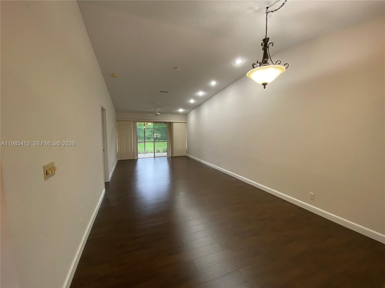 18595 Egret Way, Unit 18595 Boca Raton, FL 33496 - Photo 44 of 66 a view of a room with wooden floor and staircase
