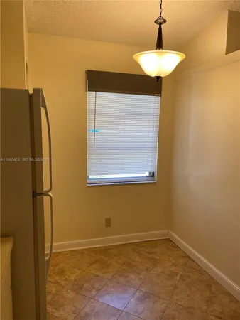 a kitchen with stainless steel appliances a refrigerator a stove a microwave and cabinets