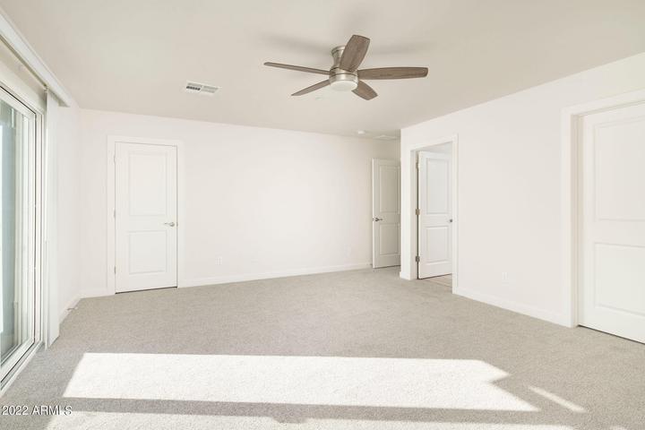 4210 North 28th Street, Unit 1 Phoenix, AZ 85016 - Photo 4 of 9 a view of a livingroom with a ceiling fan and window