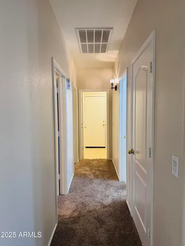 a view of a hallway with a shower