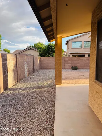 a view of a backyard of the house