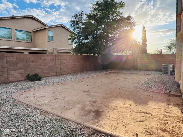 a view of a backyard of the house