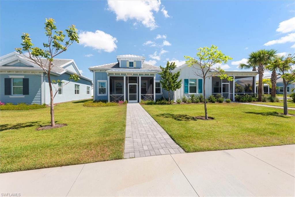 7315 Cayo Coco Lane Naples, FL 34113 - Photo 1 of 30 a view of a house with swimming pool and a yard