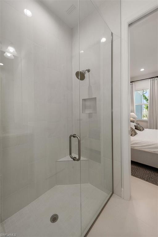 7315 Cayo Coco Lane Naples, FL 34113 - Photo 15 of 30 a bathroom with a tub and a shower