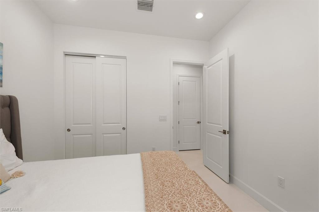 7315 Cayo Coco Lane Naples, FL 34113 - Photo 17 of 30 a bathroom with a sink and a shower