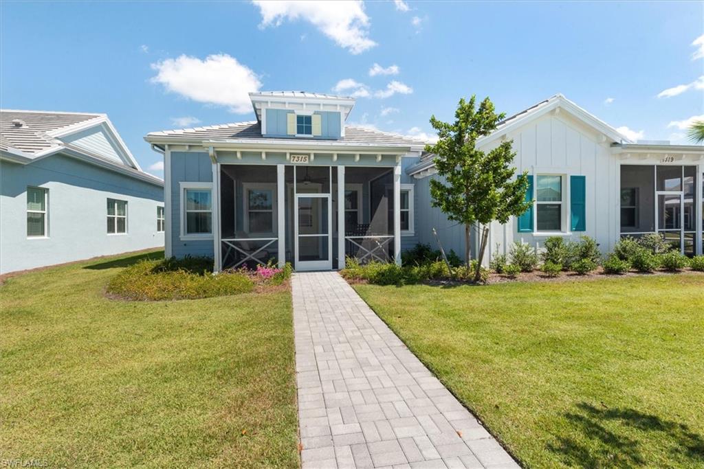 7315 Cayo Coco Lane Naples, FL 34113 - Photo 2 of 30 a view of a house with backyard and garden