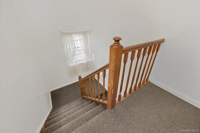 a view of wooden floor and stairs