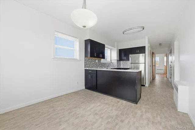 a view of a kitchen with a sink