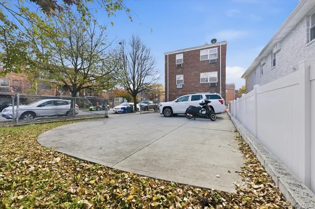 a view of street with parked cars