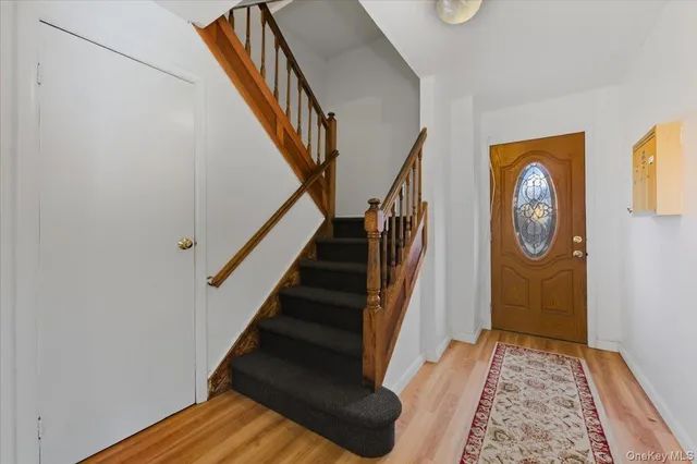 a view of entryway with wooden floor