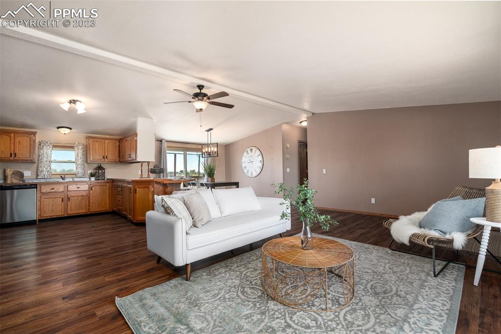 5695 Peerless Farms Road Peyton, CO 80831 - Photo 11 of 50 a living room with furniture and a wooden floor