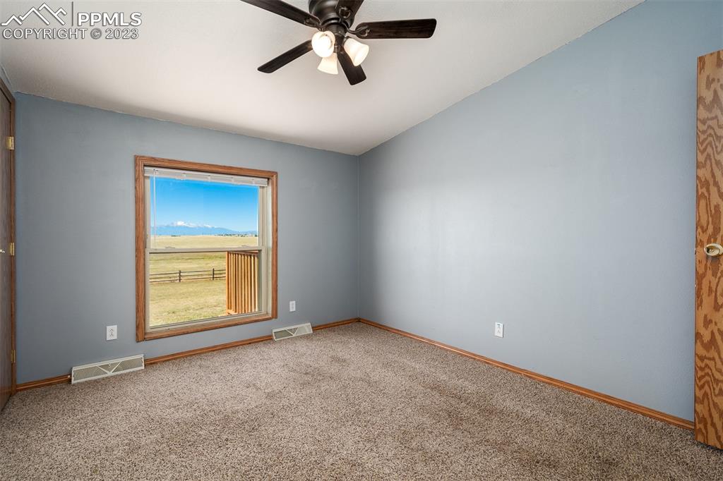 5695 Peerless Farms Road Peyton, CO 80831 - Photo 31 of 50 an empty room with a window