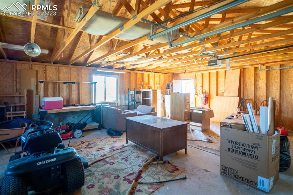 5695 Peerless Farms Road Peyton, CO 80831 - Photo 35 of 50 a room with lots of wooden furniture and a shower