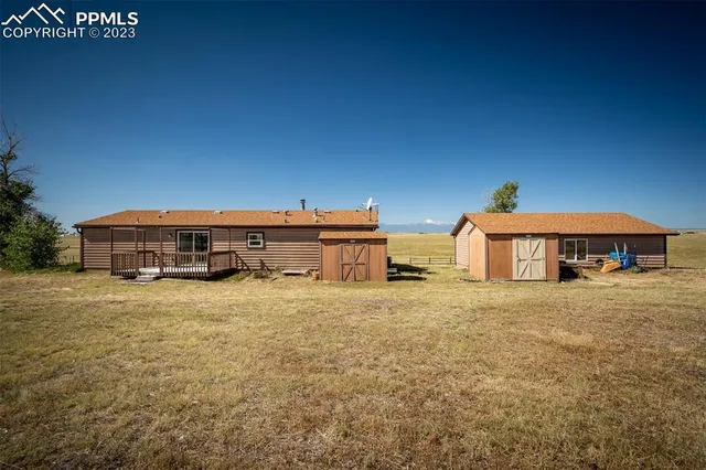 a view of residential houses with an ocean view