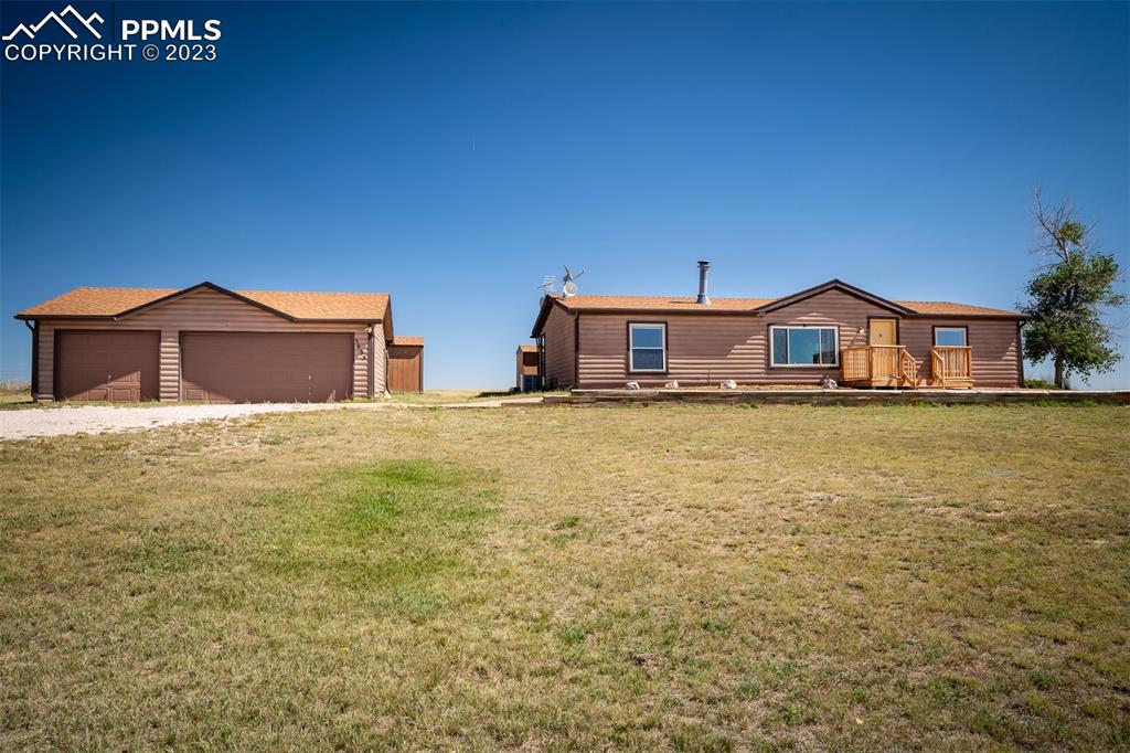 5695 Peerless Farms Road Peyton, CO 80831 - Photo 50 of 50 a house view with a lake view